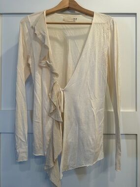 Light Cream Ruffle Wrap with simple tie closure.